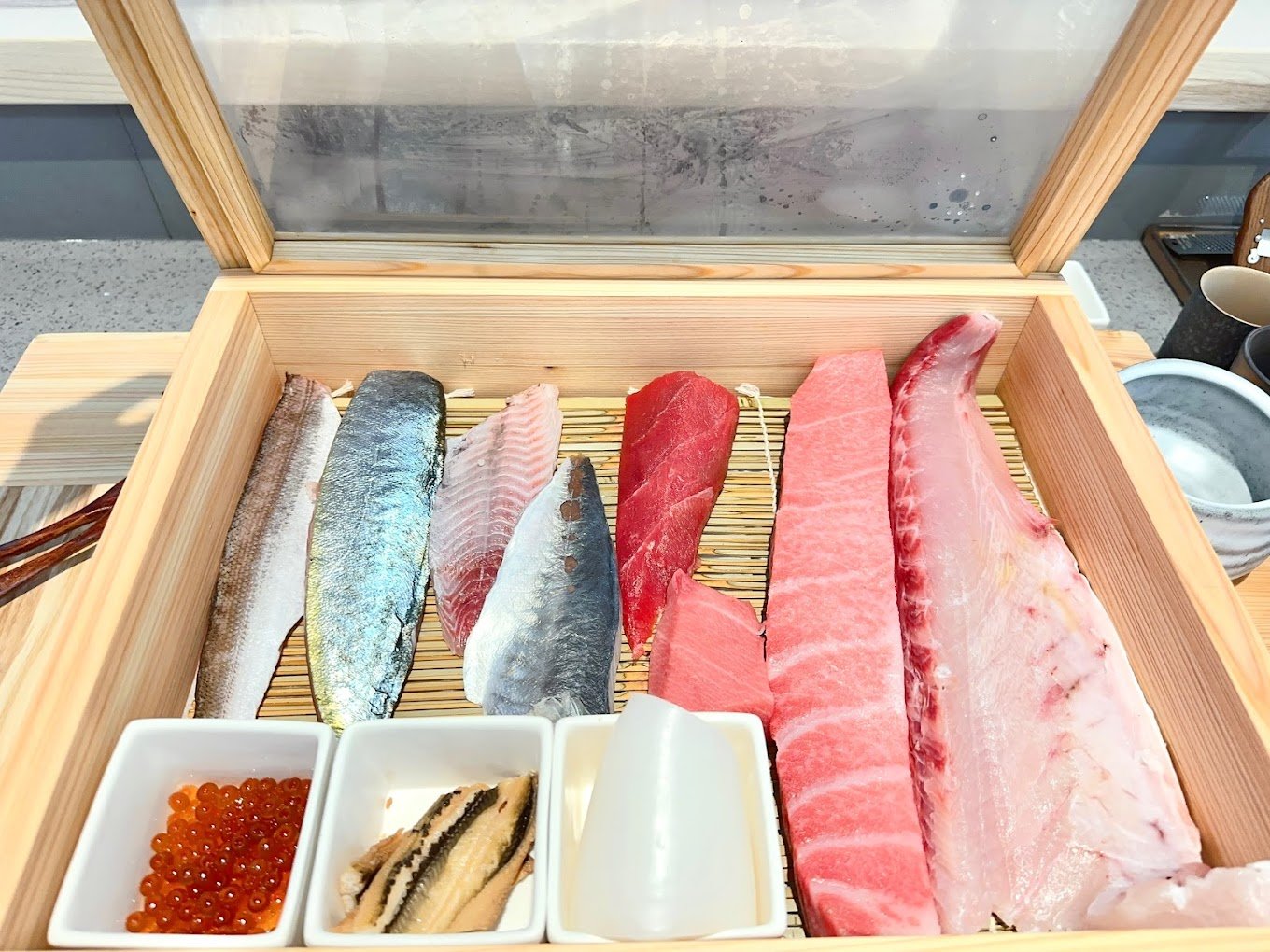 selection of seafood in a wooden box